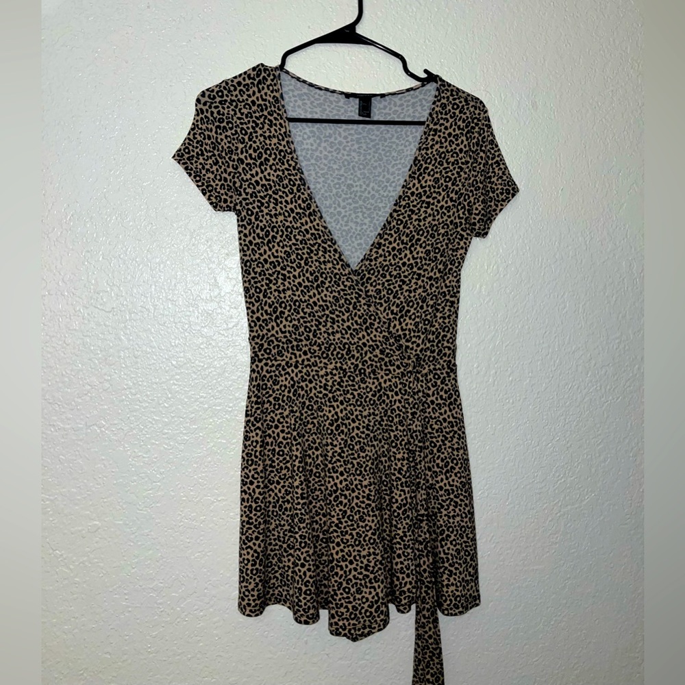Leopard print play suit with deep V